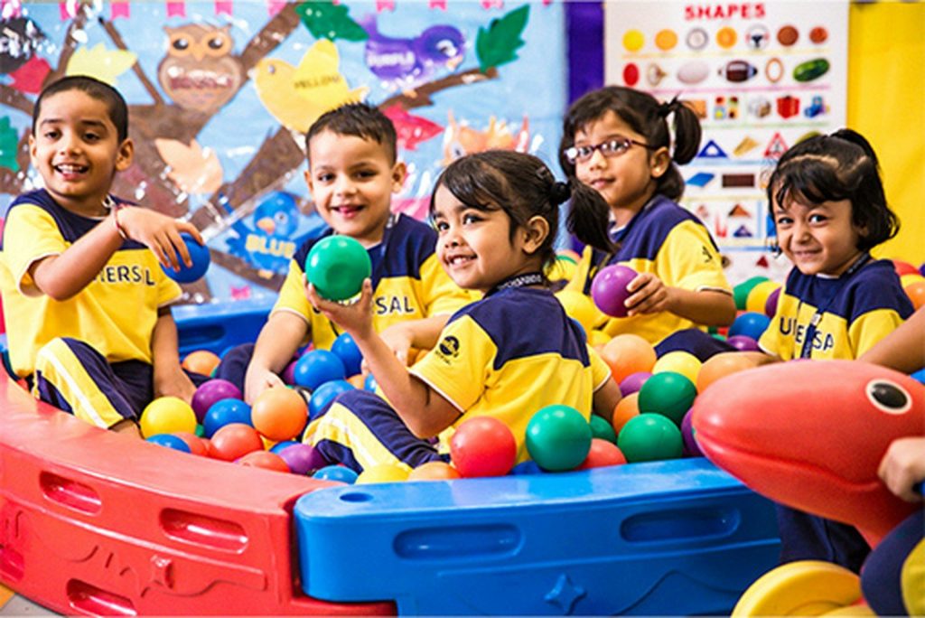 A group of children playing in a ball pit
