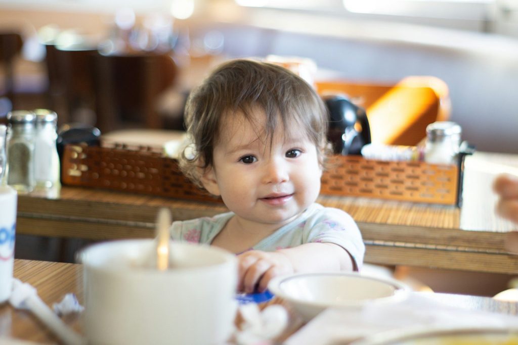a child sitting at a table
