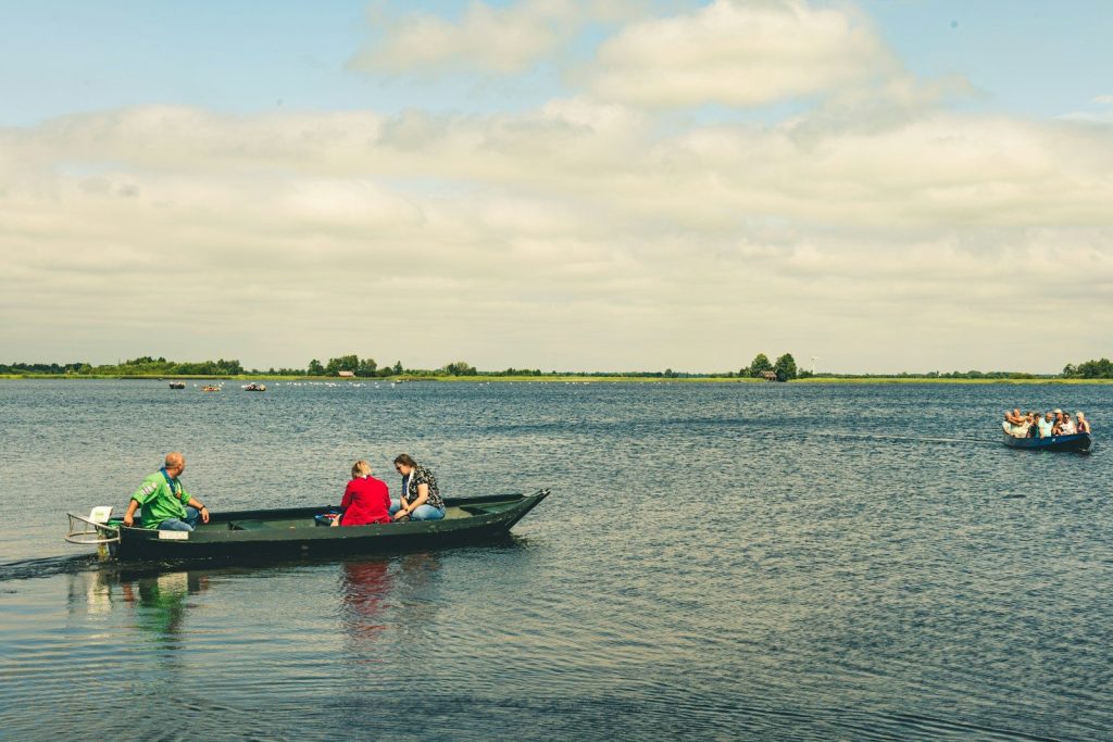 People in a boat on a large lake