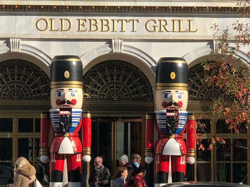 a group of people standing in front of a building