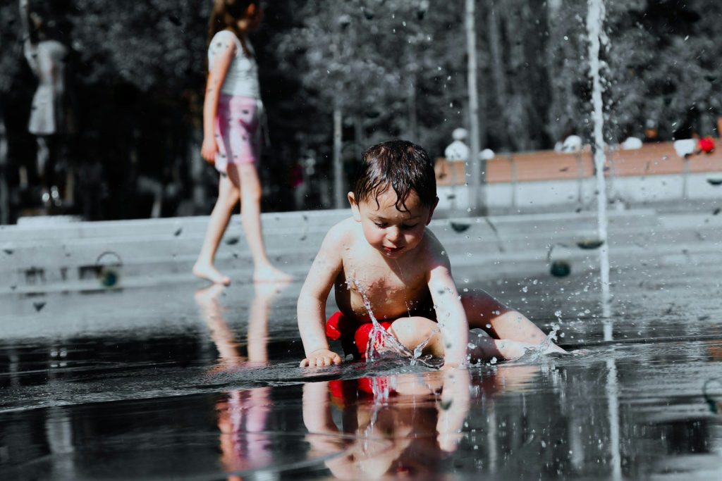a boy playing in the water