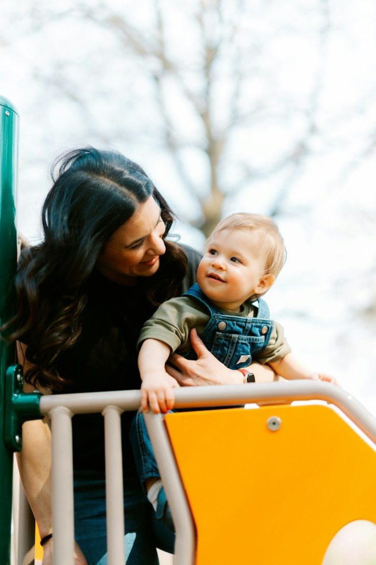 Mother and child on a playground slide